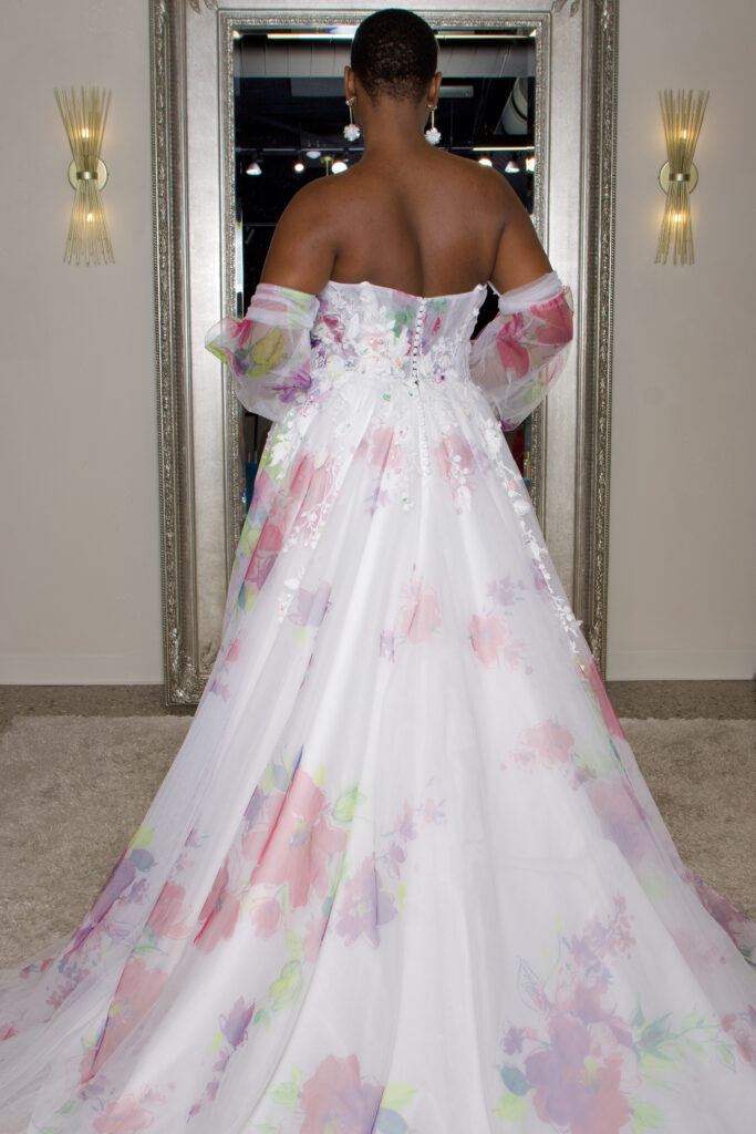The back of Presley, a sweet heart gown with 3D applique and removable off the shoulder sleeves and a slit.