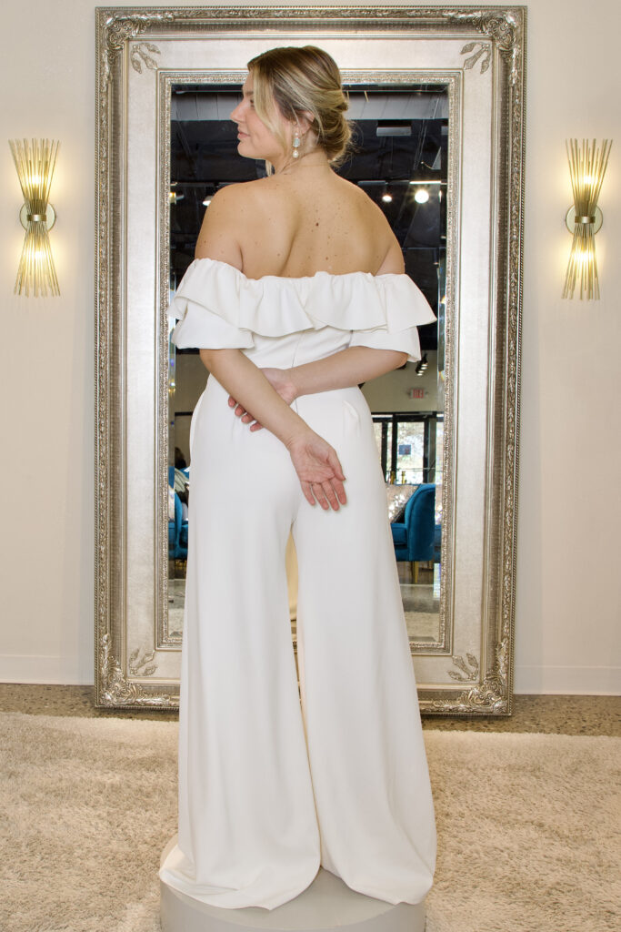 This is Scarlet Jimmie, a wedding outfit that's unique! This is a white size 10 jumpsuit