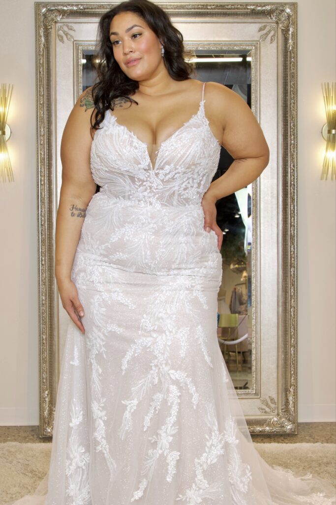 Highlands is a light-champagne-colored dress with sparkly elements and intricate lace