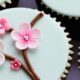 a selection of cherry-blossom-adorned cupcakes for a spring wedding