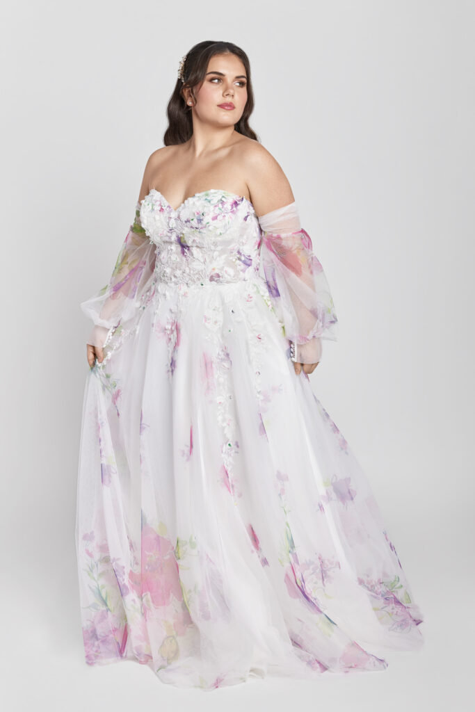 Presley is a gorgeous watercolor and lace a-line wedding dress with bishop sleeves.