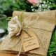 small burlap wedding favor with a fabric rose tied to it for a summer wedding