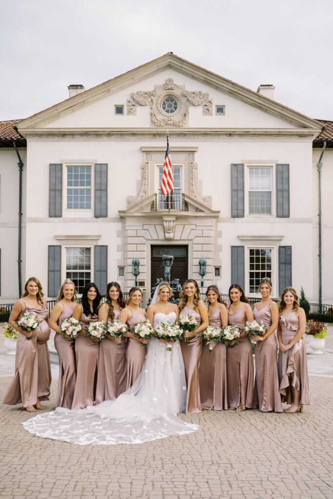 bridal party posed in front of the War Memorial wedding venue
