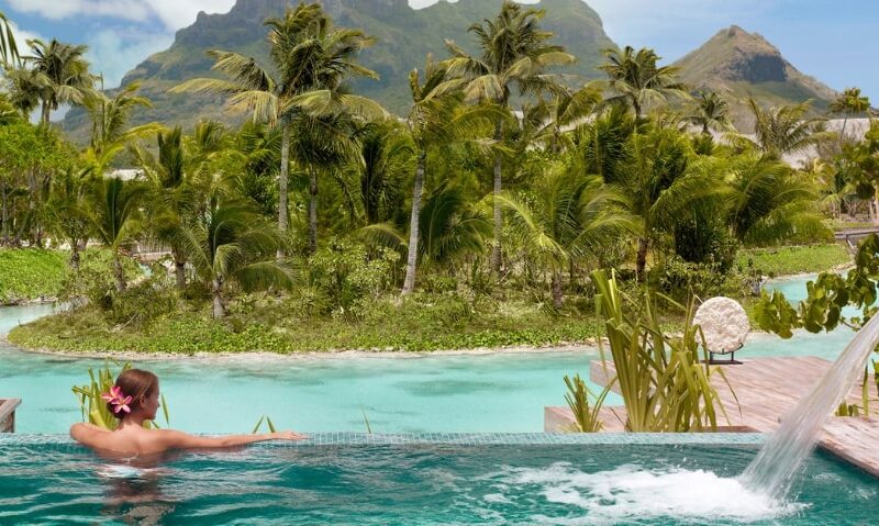incredible view of Bora Bora from a pool in a private hotel