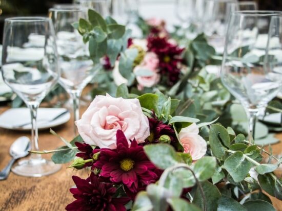 beautiful wedding table setting with white and deep magenta flowers