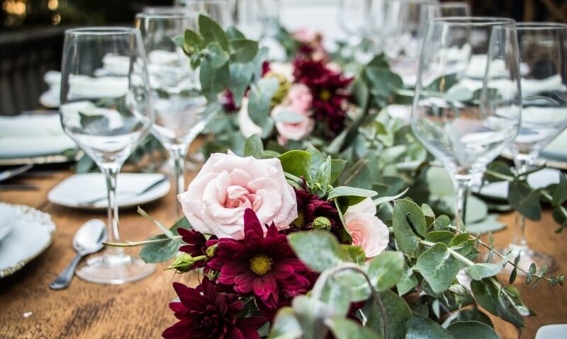 beautiful wedding table setting with white and deep magenta flowers