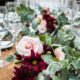 beautiful wedding table setting with white and deep magenta flowers