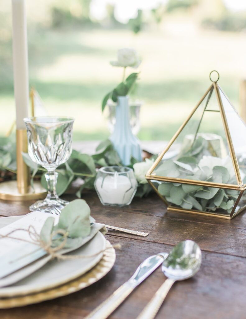 autumn wedding table set up with green and metallic gold accents in Michigan