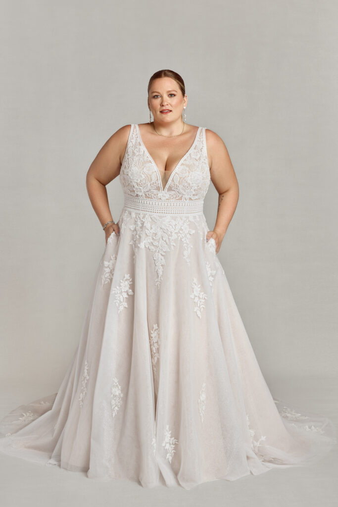 A plus-size wedding dress that's the perfect mix of boho and traditional, with a flattering waistline