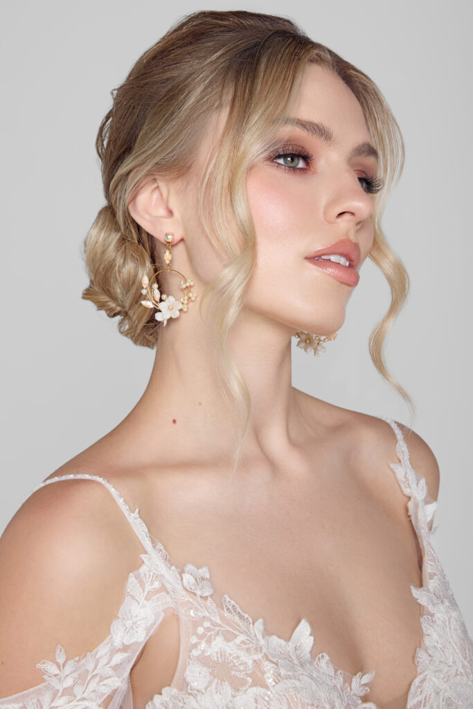 Woman wearing Australian crystal floral hoops with intricate floral details