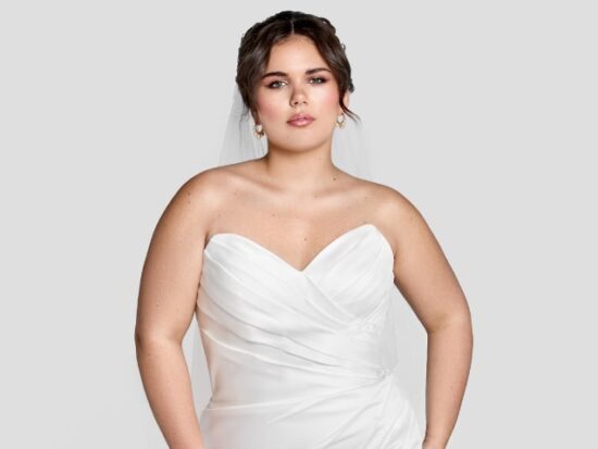 Rachel - a strapless, sweetheart gown with flattering asymmetrical ruching and a skirt slit. The clean lines and simplicity of Rachel make her perfect for just about any destination!