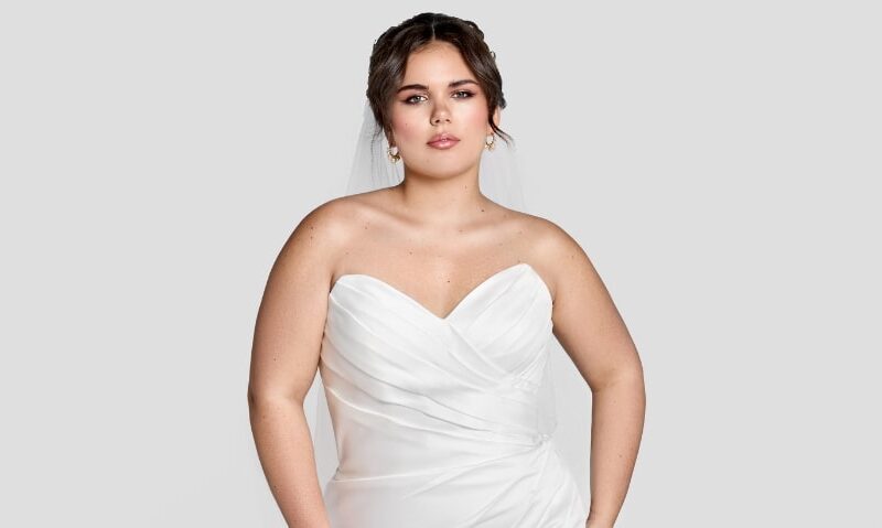 Rachel - a strapless, sweetheart gown with flattering asymmetrical ruching and a skirt slit. The clean lines and simplicity of Rachel make her perfect for just about any destination!