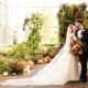 Happy married couple posing for wedding photos at the Frederick Meijer Gardens in Michigan