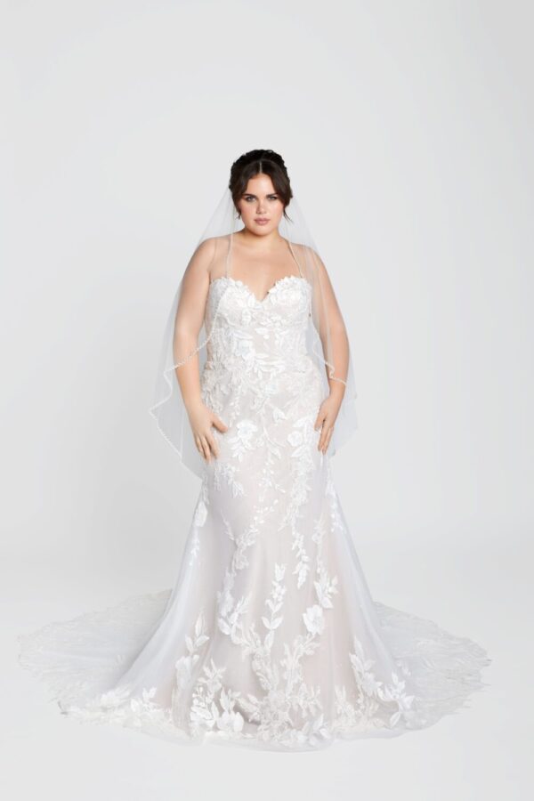 Plus Size bride modeling one of her favorite faerie wedding gowns from The Wedding Shoppe in Berkley, MI.