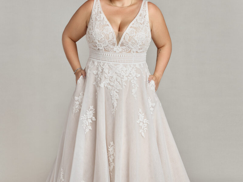 Gorgeous plus size bride to be wearing an affordable wedding dress that looks just like expensive wedding dresses.