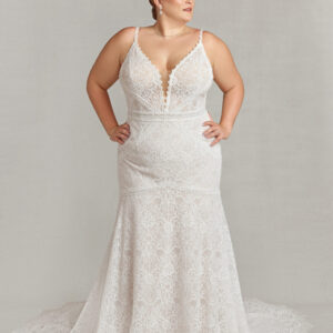 Classy bride to be modeling a vintage style wedding dress with spaghetti straps and lace overlay.