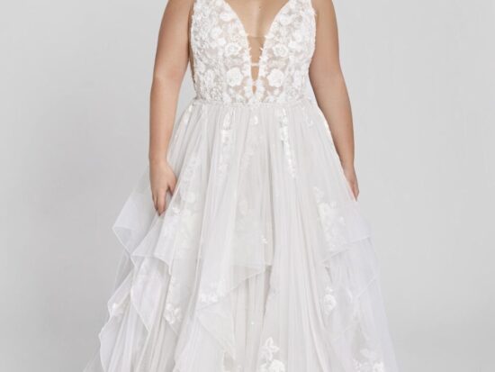 Charming bride to be wearing a square neckline wedding dress with floral lace on the bodice and decals throughout the tulle skirt.