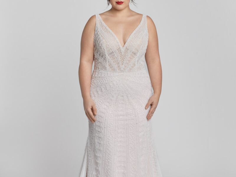 An art deco inspired wedding dress with geographic lace pattern worn by a saucy bride from The Wedding Shoppe in Berkley, MI.