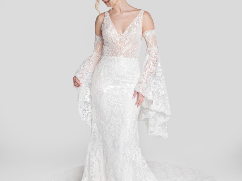 Unique boho lace wedding dress with see through bodice and removable, lace bell shaped sleeves.