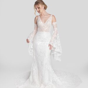 Unique boho lace wedding dress with see through bodice and removable, lace bell shaped sleeves.