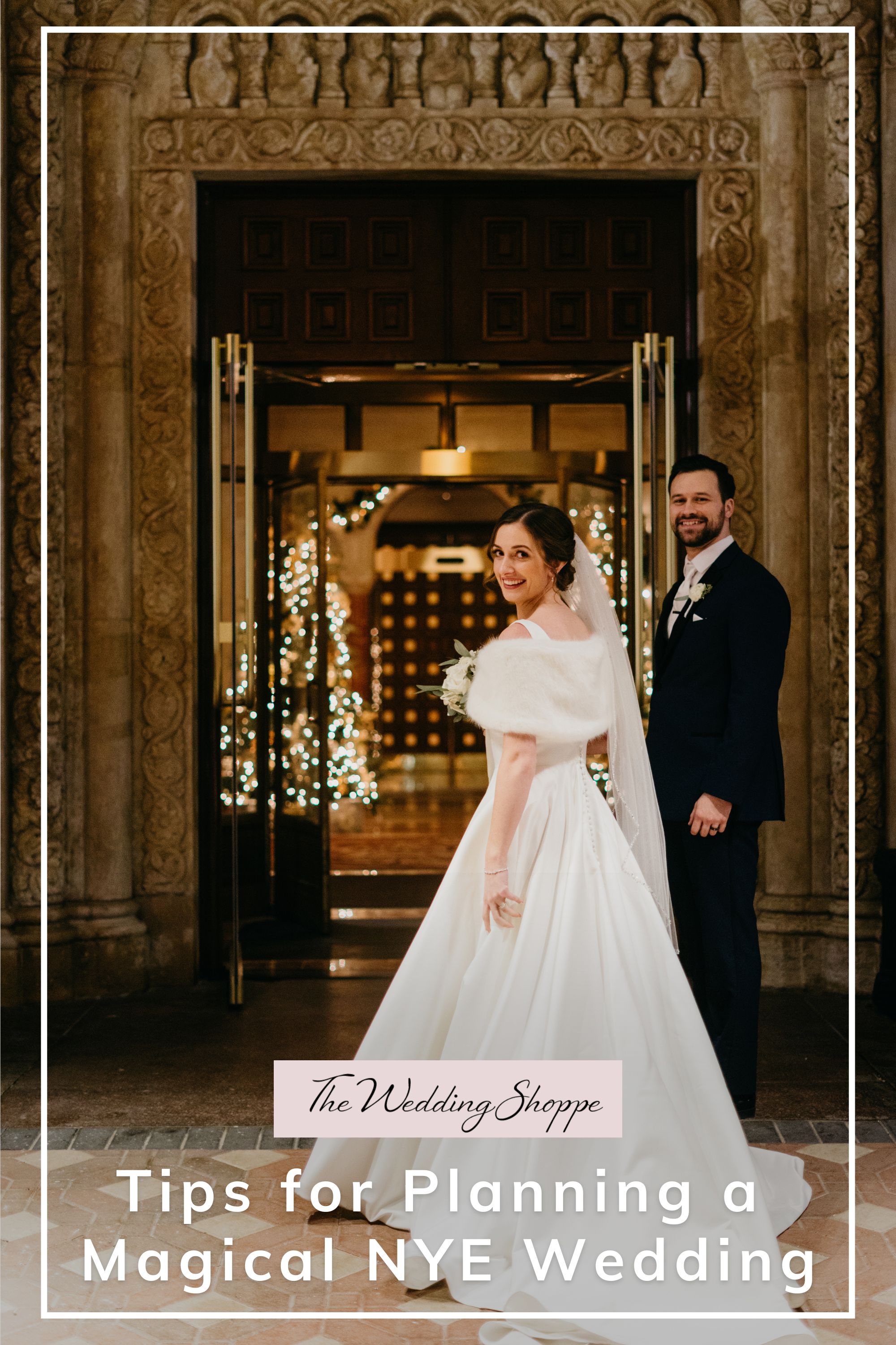 A radiant bride and groom stand under an ornate doorway with twinkling lights, capturing the charm of their NYE wedding.