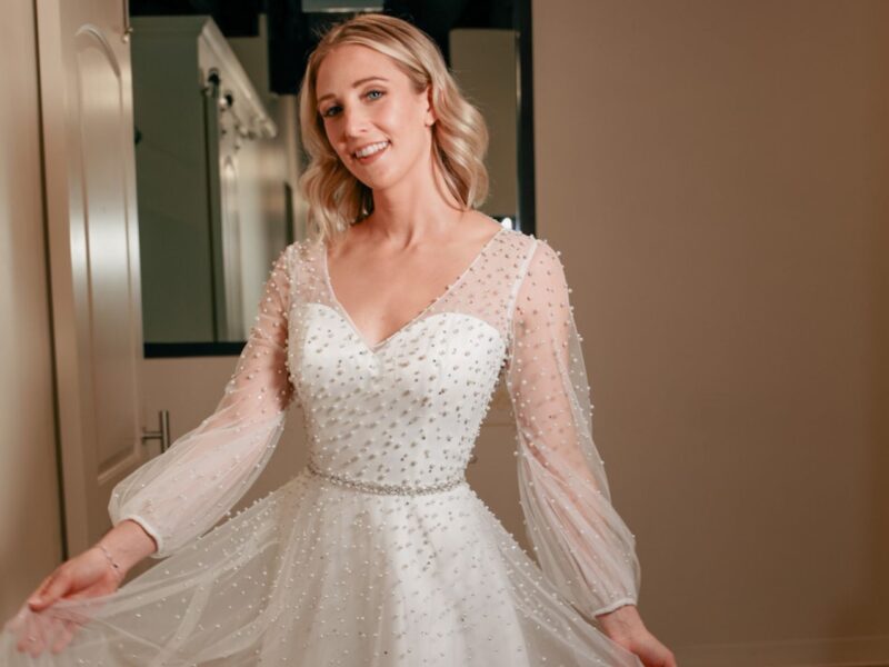 Close-up of a lace gown with intricate beadwork, perfect for an elegant New Year's Eve wedding look.