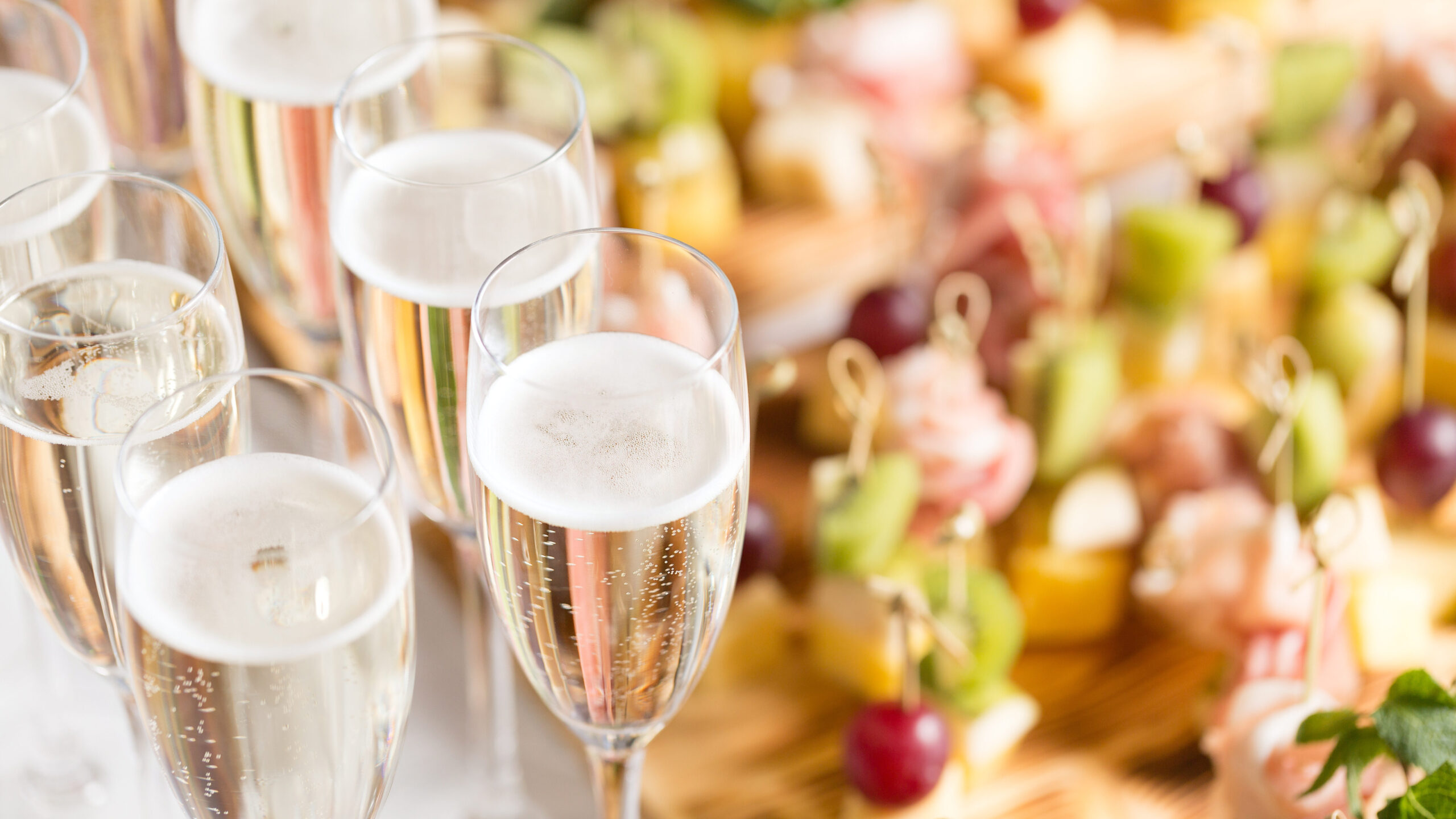 Spread of alcoholic beverages for celebration toasting at wedding reception.