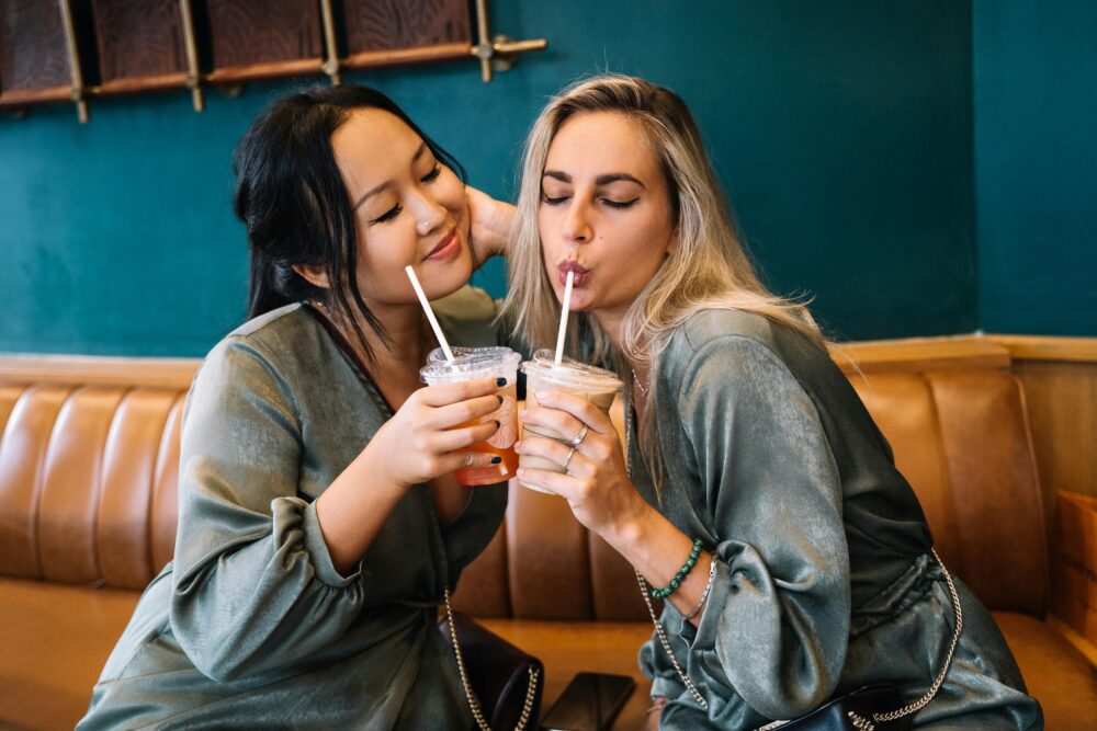 Two brides sipping cafee margaritas at The Wedding Shoppe bridal bar crawl.