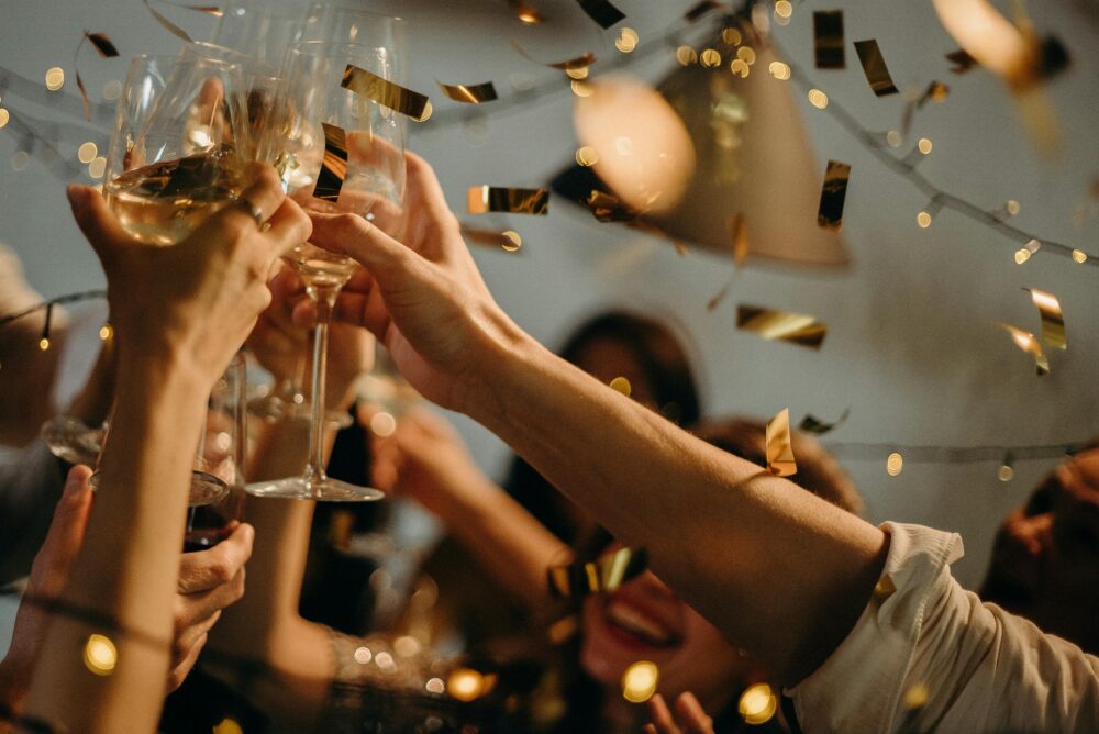 lively party cheersing champagne flutes