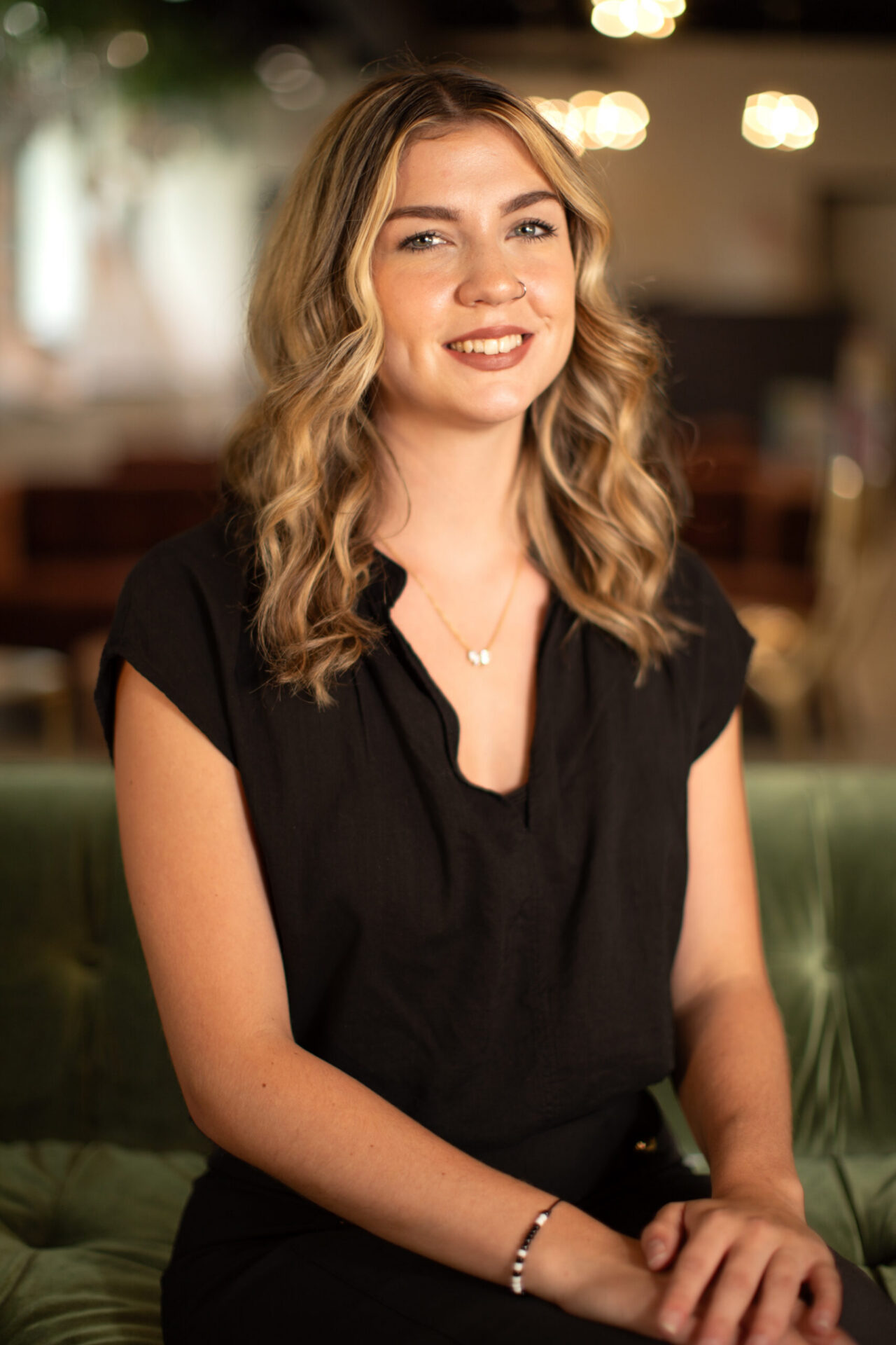 Smiling woman in black dress
