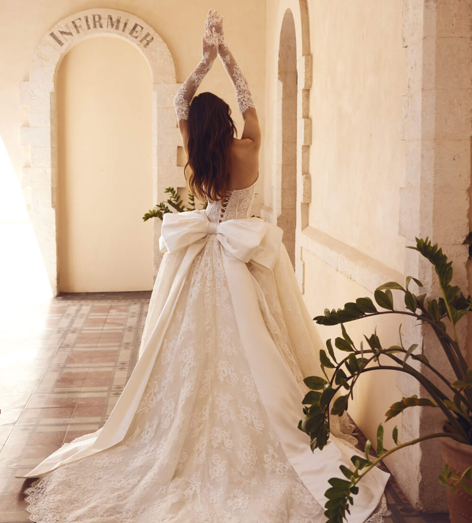 bride showing off her bridal gloves