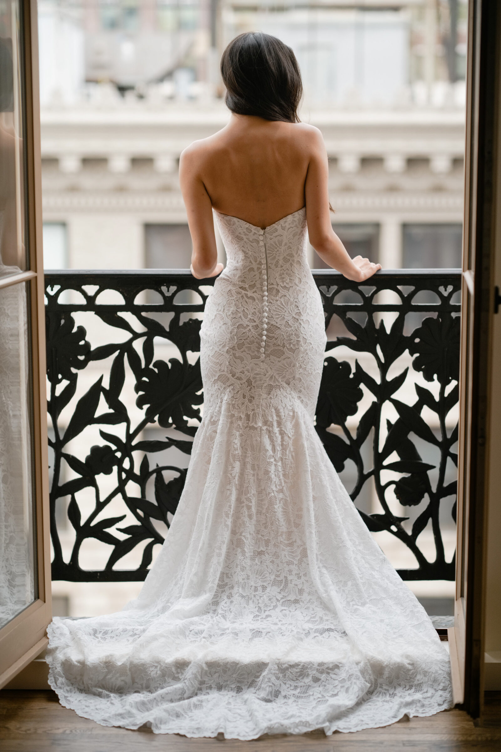 la premiere, lace mermaid wedding dress with buttons down the spine.