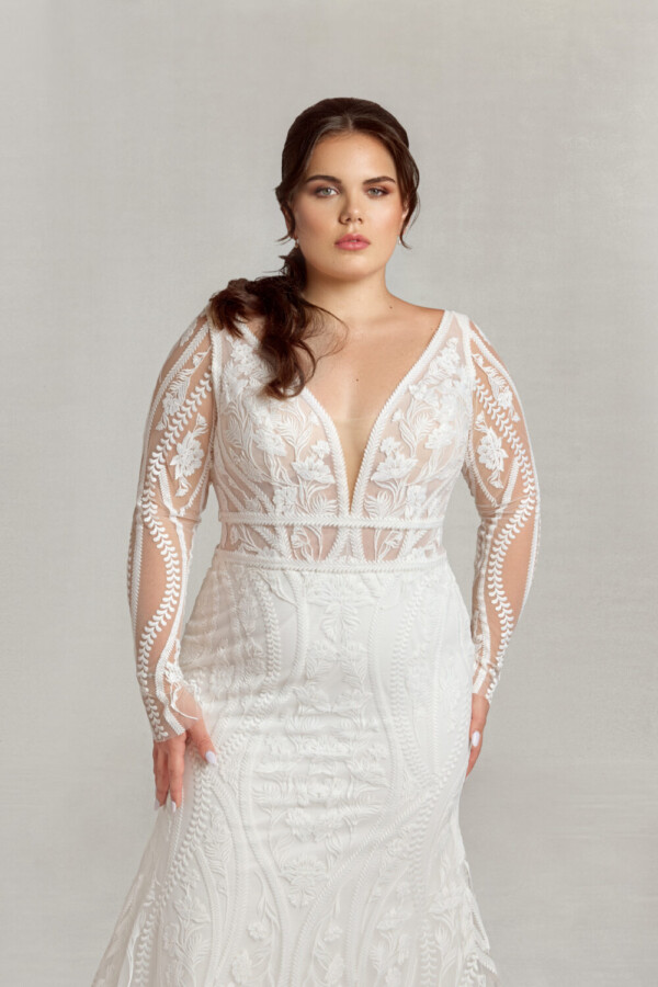 Model wearing the Ashrina wedding dress. A modest wedding dresses with long sleeves.