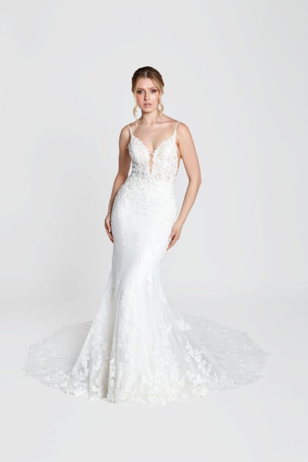 Simple bohemian wedding dress with spaghetti straps and deep v cut bodice with a lace overlay train.
