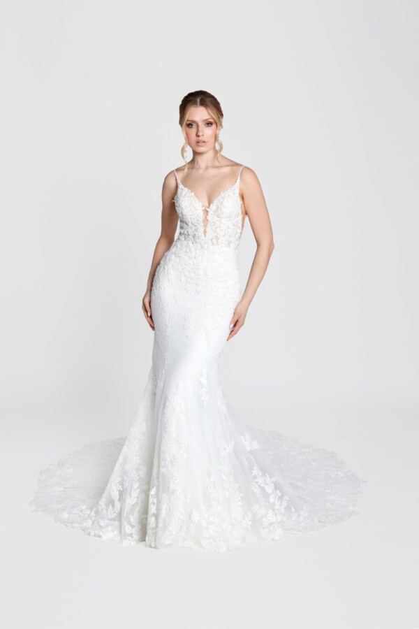 Simple bohemian wedding dress with spaghetti straps and deep v cut bodice with a lace overlay train.