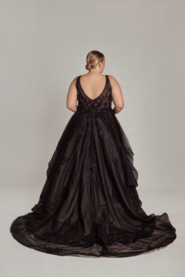 Gorgeous bride to be showing off her black gothic wedding dress with subtle sparkles on the skirt.