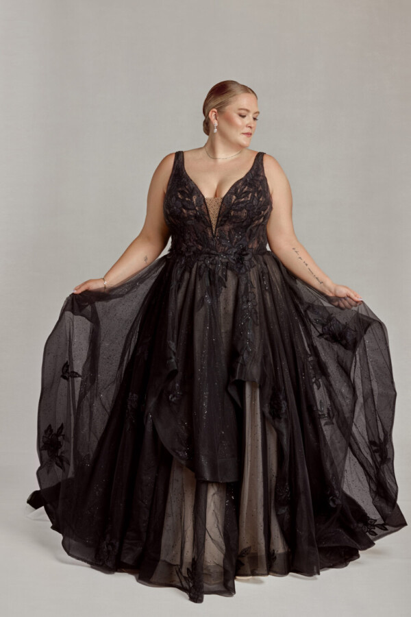 Gorgeous bride to be showing off her black gothic wedding dress with subtle sparkles on the skirt. Just one of the many non traditional plus size wedding dresses from The Wedding Shoppe.