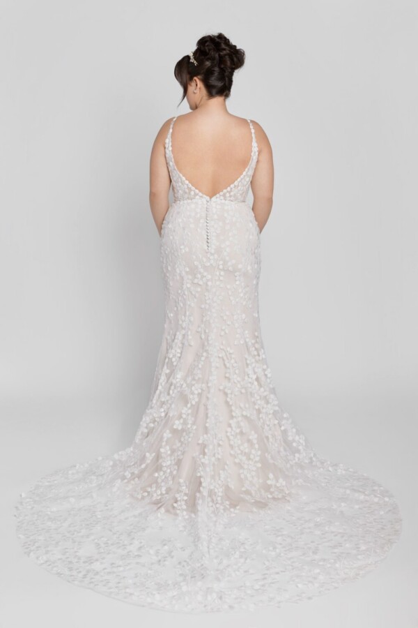 Unique style wedding dress with small baubles patterned throughout the dress and buttons down the back.