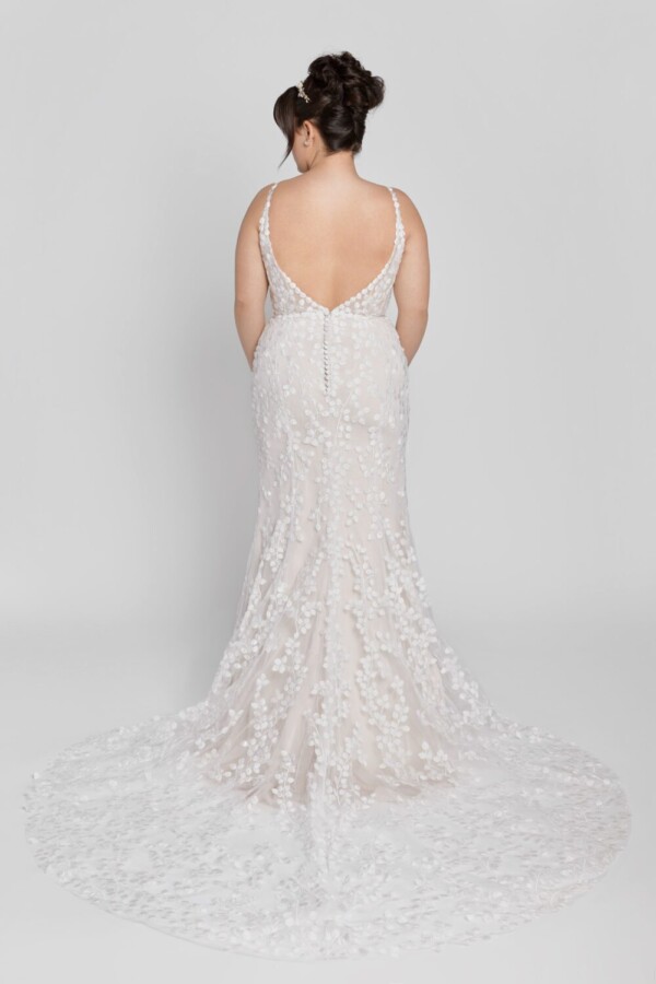 Unique style wedding dress with small baubles patterned throughout the dress and buttons down the back.