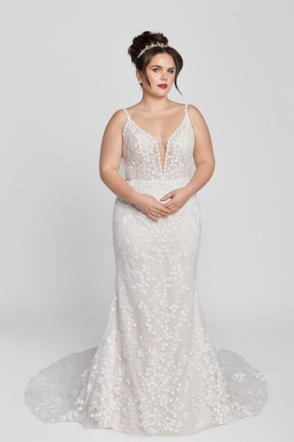 Unique style wedding dress with small baubles patterned throughout the dress and buttons down the back.