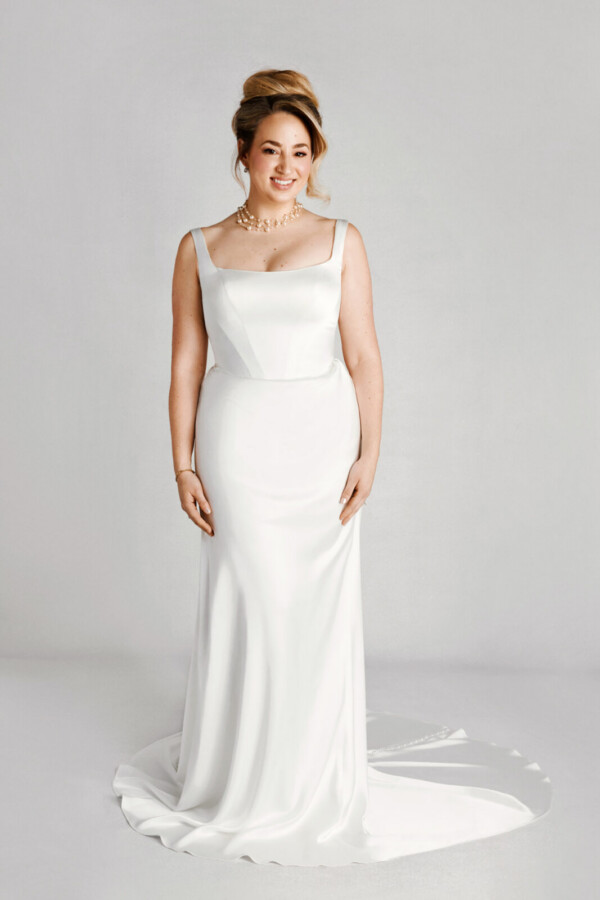 A bride in a white strapped dress